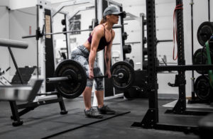 woman deadlift barbell