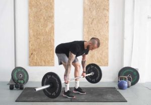 man deadlift barbell bent over