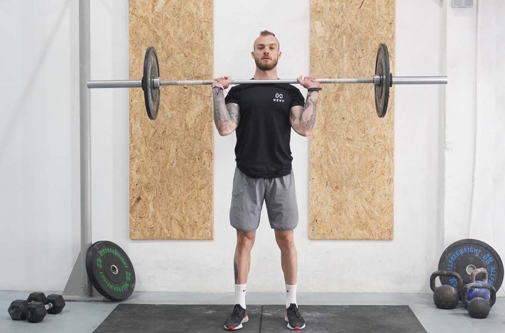 man push press barbell standing