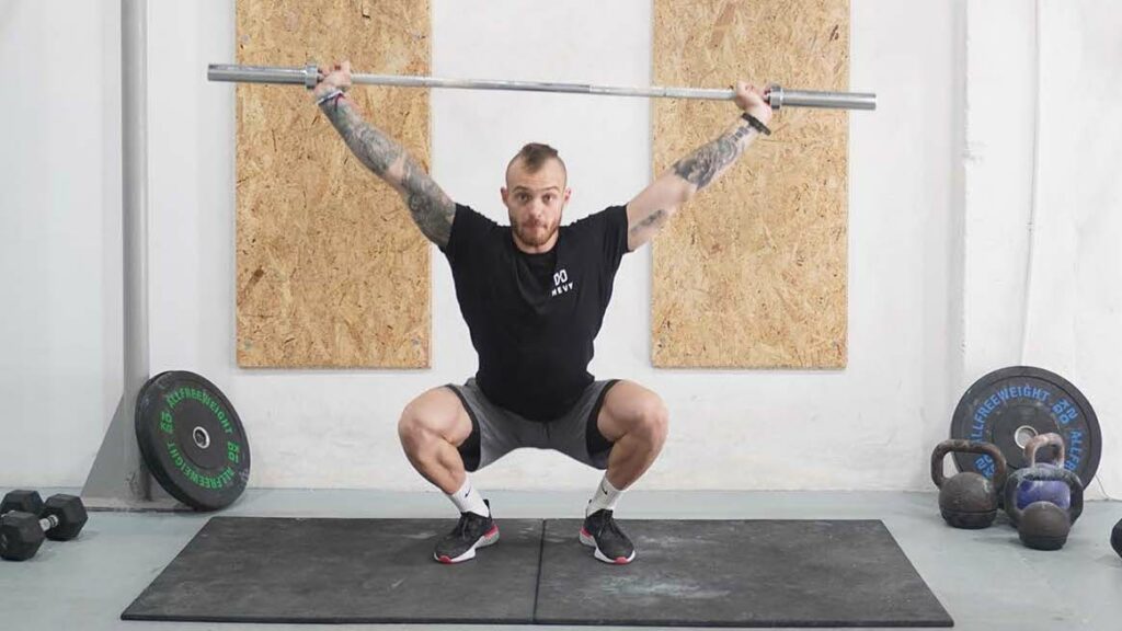 man overhead squat barbell hang snatch 