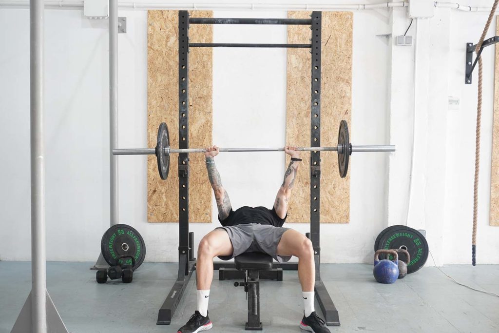 man bench press barbell